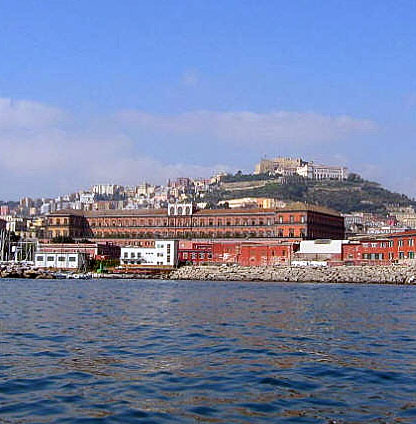 Royal Palace seen from the Sea with Castel Sant'Elmo in the distance.]
